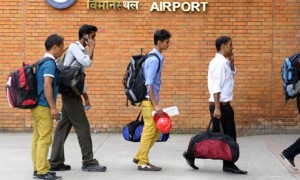 Nepalese migrant workers arrive at Kathmandu airport