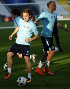 Luka Modric and defender Domagoj