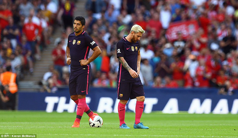 Luis Suarez  and Lionel Messi