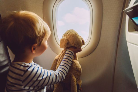 little-boy-sitting-on-an-airplane