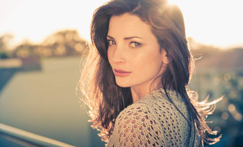 Natural beauty headshot of sexy young brunette girl outdoors