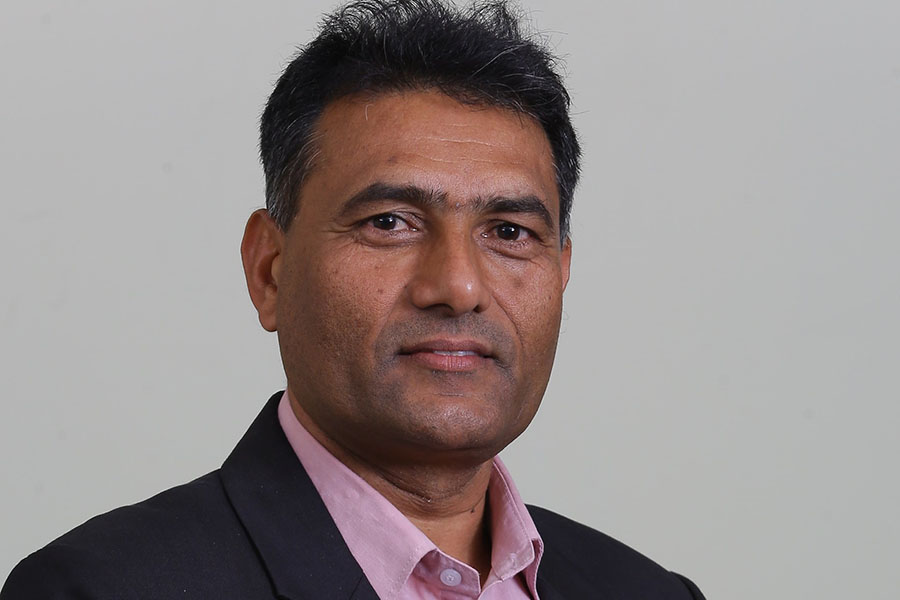 Why did Nepal Reinsurance Company President Ghimire resign?